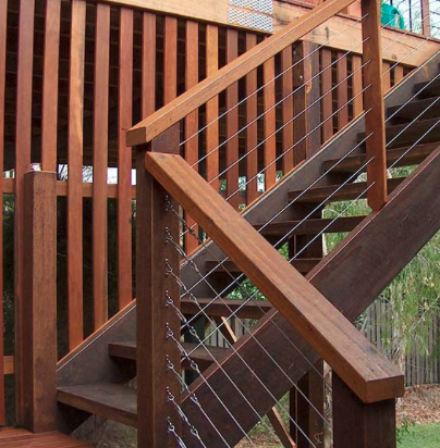 Stained hardwood stairs with cable railing in Prospect, KY